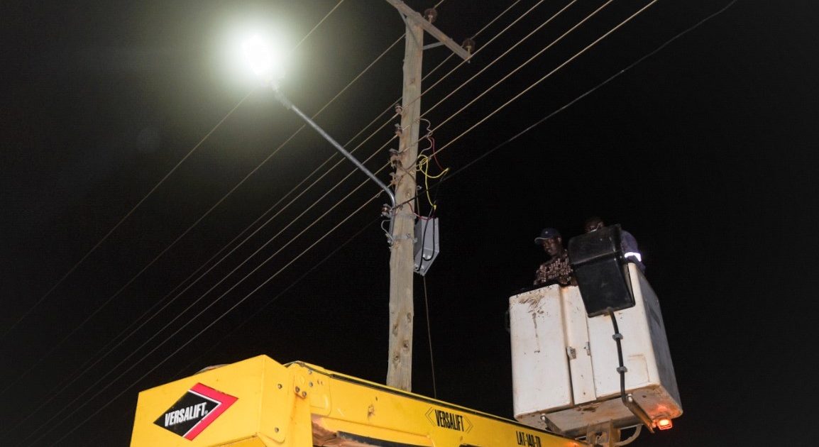Astute crew installing street lights at night